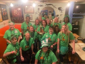 Ladies of Louisiana LunaChicks posing for a group shot after the St. Patrick's Day parade 2024